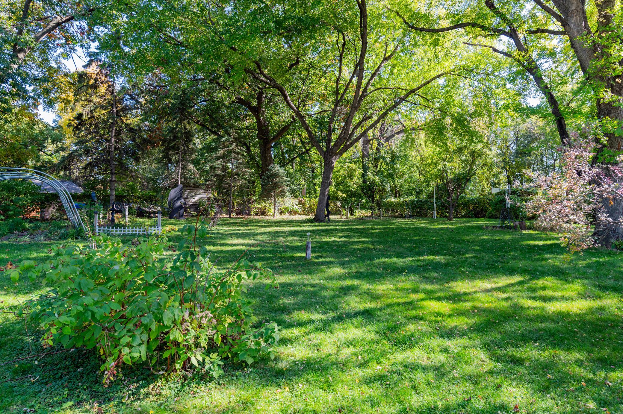 View from the deck of the spacious, private and fenced backyard.