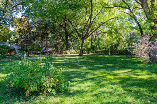 View from the deck of the spacious, private and fenced backyard.