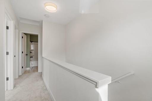 Upper level with two bedrooms and a full bathroom