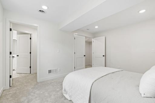 View from primary looking into walk-in closet and bathroom