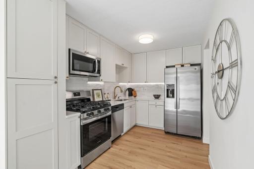 Spacious kitchen with pantry and stainless steel appliances