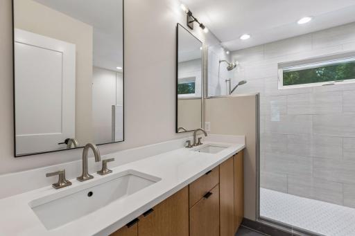 Private updated 3/4 bath with dual sinks, large step in shower