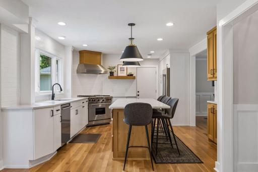 Gorgeous hardwood floors, center island with seating, thoughtful finishes