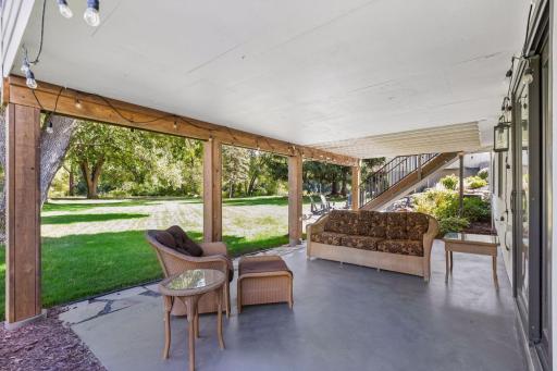 Walk out to the large patio area and backyard