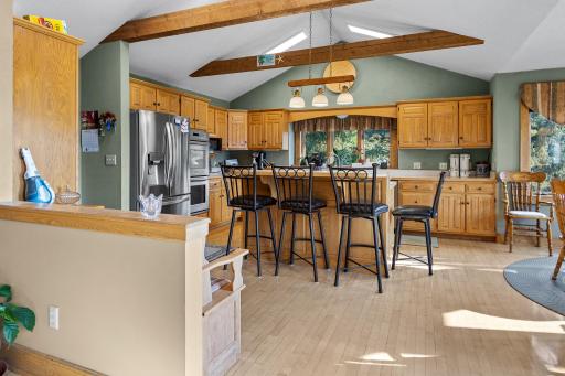 A view looking from the dining room towards the kitchens breakfast bar.