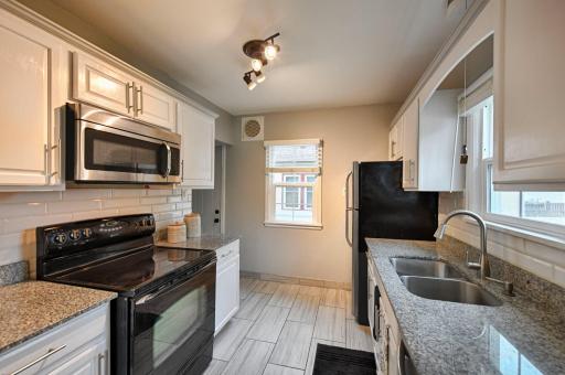 Granite counters, stainless appliances & ceramic tile floors are an updated bonus.