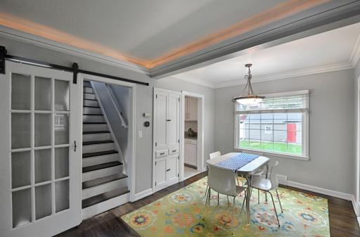 Built-in cabinet and sliding glass door are just 2 of the interesting features in the informal dining area.
