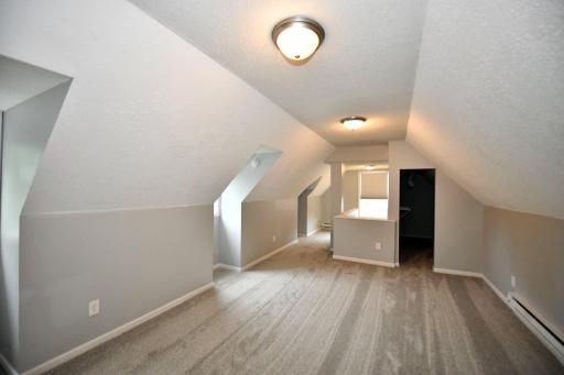 One view of the large upper level bedroom. Large closet and 2 windows!