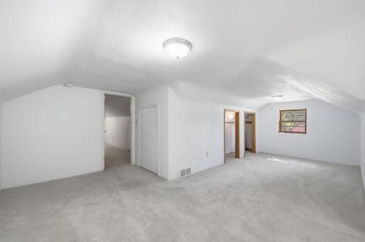 Larger of the 2 upstairs Bedroom Closets and entrance door