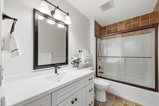 Updated bathroom with tasteful finishes.jpg