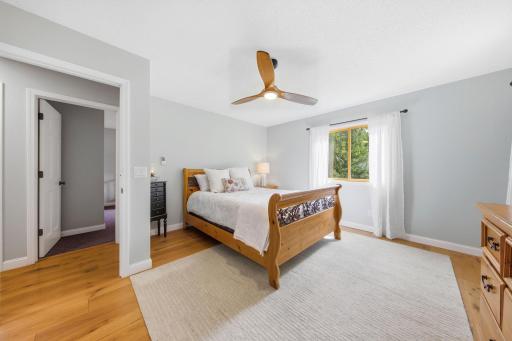 Spacious primary with ceiling fan abundant closet space.jpg