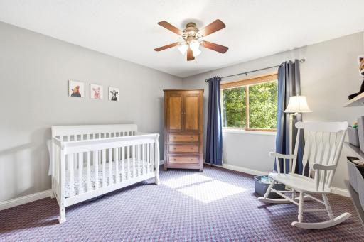 Guest bedroom with ceiling fan generous closet space.jpg