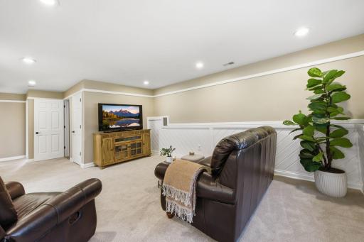Family room with tasteful neutral flooring and wall tones.jpg