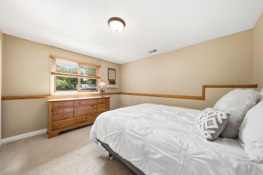 Lower level Bedroom with custom window treatments.jpg