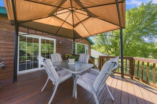 Spacious deck with staircase to backyard.jpg
