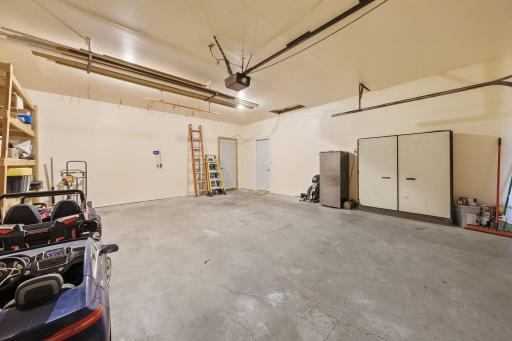 Double attached garage with service doors to home and adjoining workshop.jpg