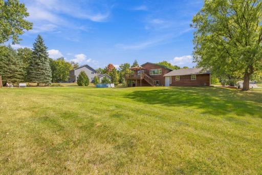 Spectacular backyard beautifully edged with mature trees.jpg