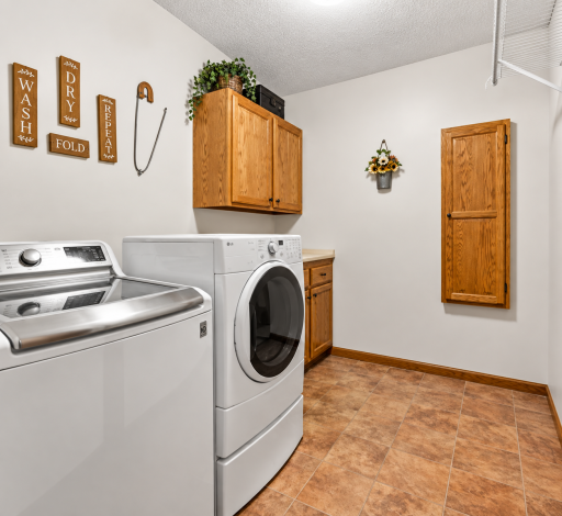 Main floor laundry - with the conveince of ironboard right in the wall.
