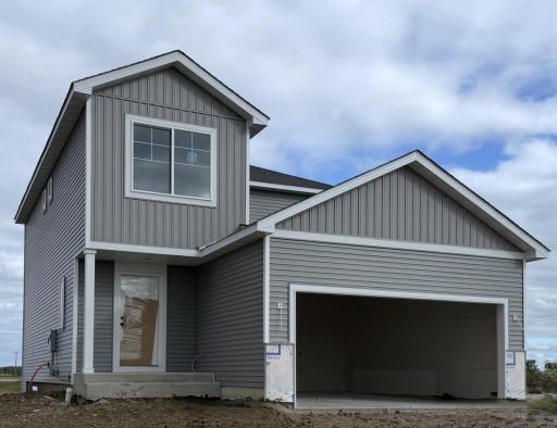 3042 Jandura Ave NE- Home features a Walkout Lower Level ready for future finish. Stone accents and garage door will be installed soon. Landscaping, Sod, and Irrigation System included.