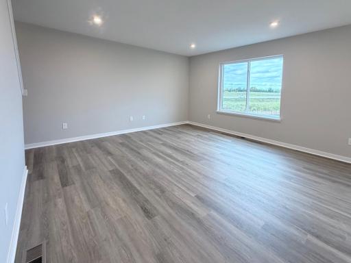 PHOTO OF A DIFFERENT HOME WITH SIMILAR PLAN AND FINISHES. Great Room
