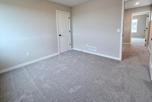 PHOTO OF A DIFFERENT HOME WITH SIMILAR PLAN AND FINISHES. Upper Bedroom 2.