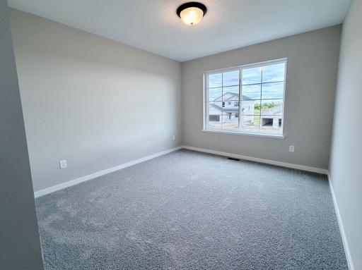 PHOTO OF A DIFFERENT HOME WITH SIMILAR PLAN AND FINISHES. Bedroom 3.