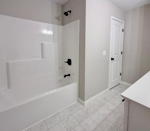 PHOTO OF A DIFFERENT HOME WITH SIMILAR PLAN AND FINISHES. Upper Full Bath.