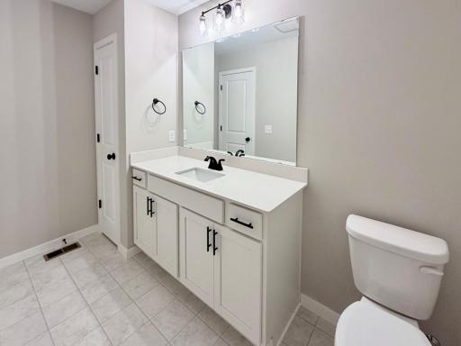 PHOTO OF A DIFFERENT HOME WITH SIMILAR PLAN AND FINISHES. Upper Main Full Bathroom features a Linen Closet for added storage.