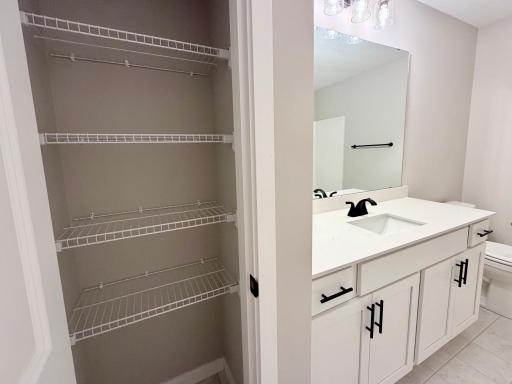 PHOTO OF A DIFFERENT HOME WITH SIMILAR PLAN AND FINISHES. Upper Main Full Bath.