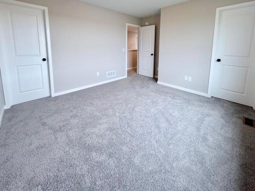 PHOTO OF A DIFFERENT HOME WITH SIMILAR PLAN AND FINISHES. Upper Primary Suite.