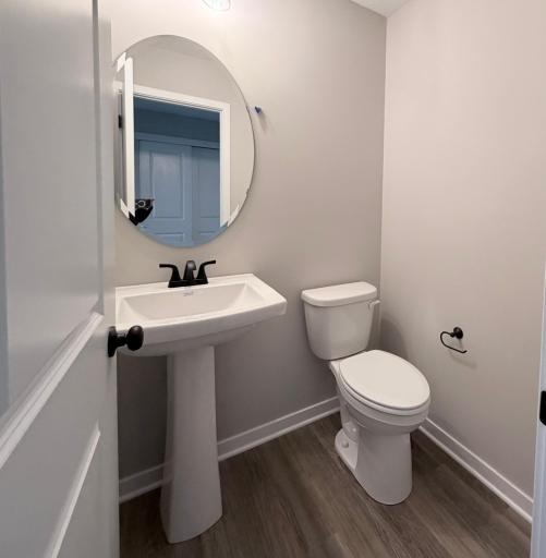 PHOTO OF A DIFFERENT HOME WITH SIMILAR PLAN AND FINISHES. Main floor Half Bath.
