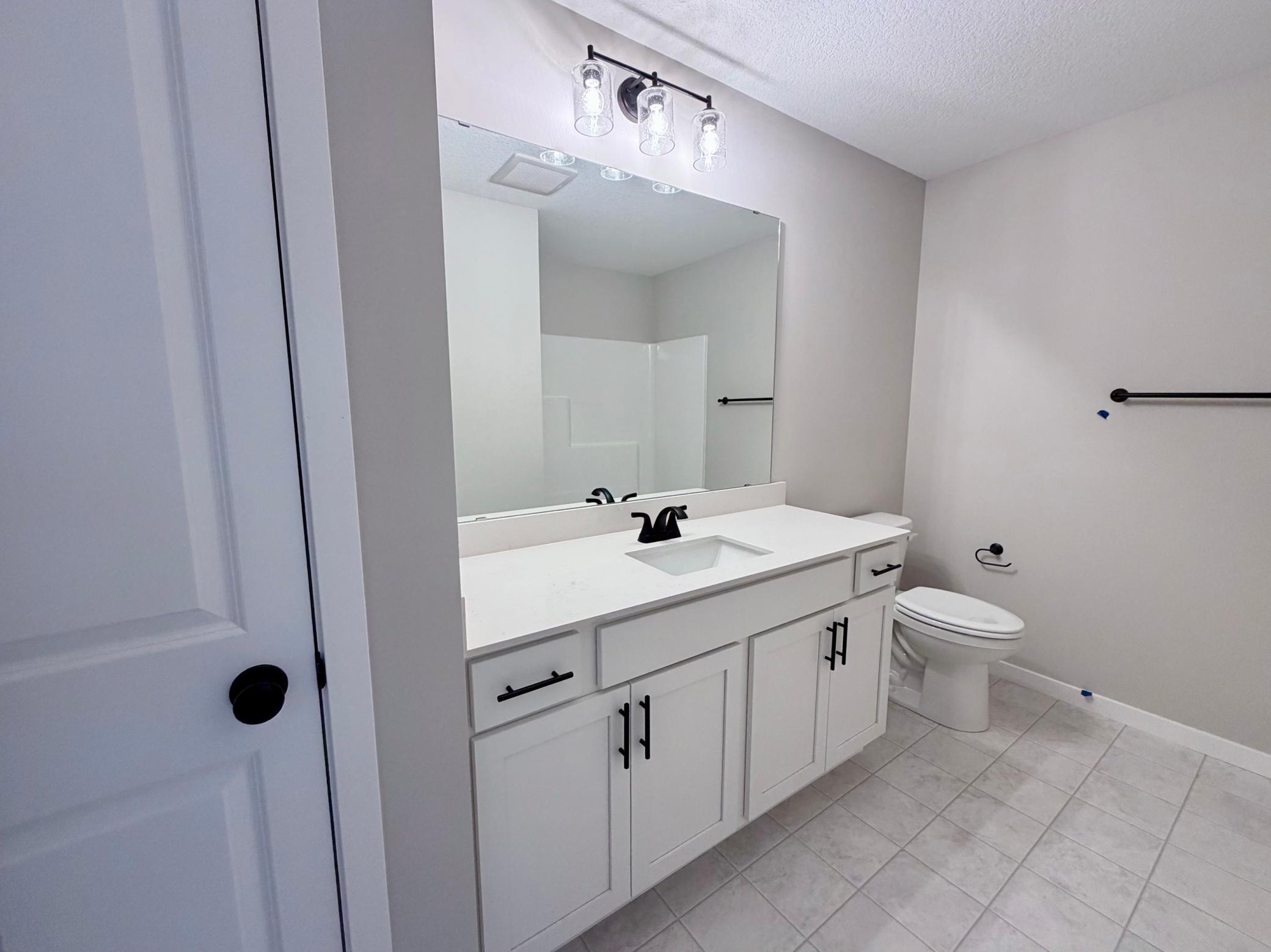 PHOTO OF A DIFFERENT HOME WITH SIMILAR PLAN AND FINISHES. Upper Floor Main Full Bath.