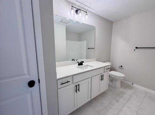 PHOTO OF A DIFFERENT HOME WITH SIMILAR PLAN AND FINISHES. Upper Floor Main Full Bath.