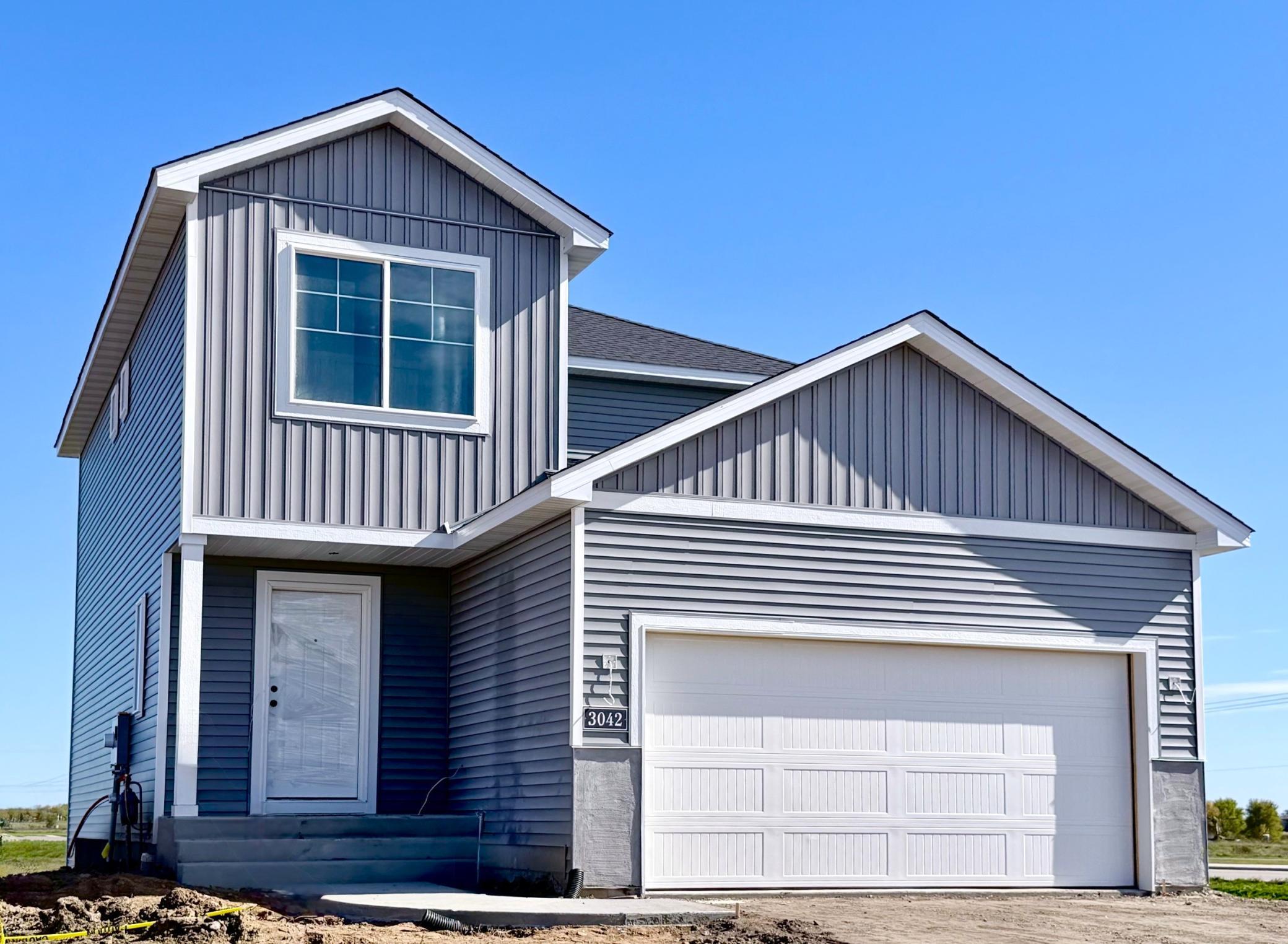 3042 Jandura Ave NE- New Construction Home will be ready for a November move-in! Highlights include a Walkout Lower Level ready for future finish. Stone accents & driveway will be installed soon. Landscaping, Sod, and Irrigation System included.