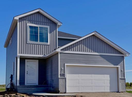 3042 Jandura Ave NE- New Construction Home will be ready for a November move-in! Highlights include a Walkout Lower Level ready for future finish. Stone accents & driveway will be installed soon. Landscaping, Sod, and Irrigation System included.