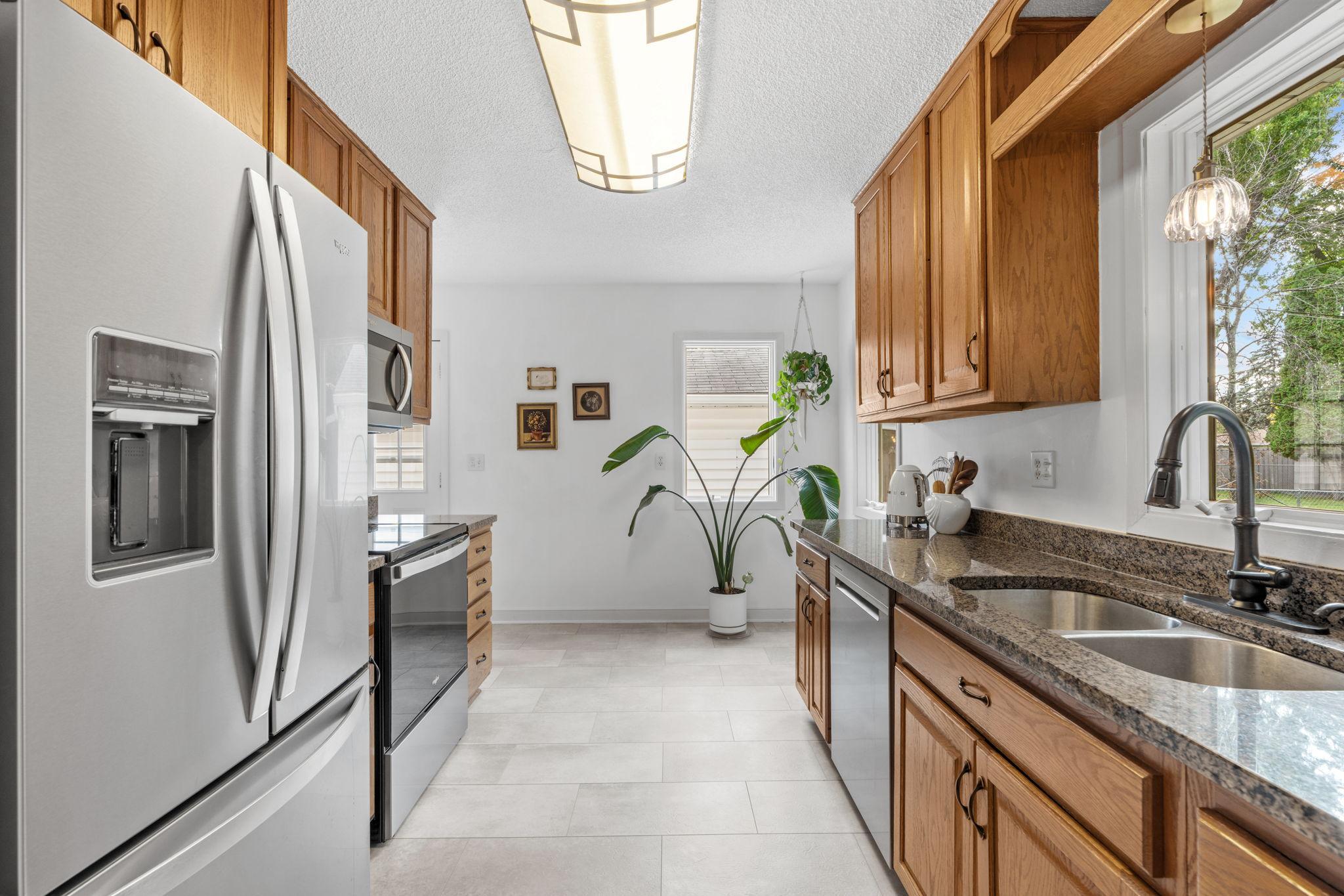 Kitchen w/ New Flooring, Oak Cabinets, Stainless Steel Appliances and Granite Counters