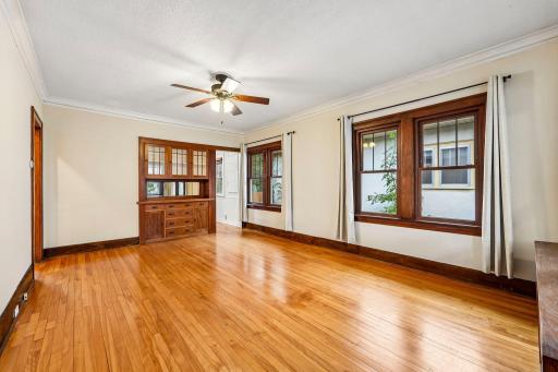 Living room featuring hardwood floors and built-in cabinetry