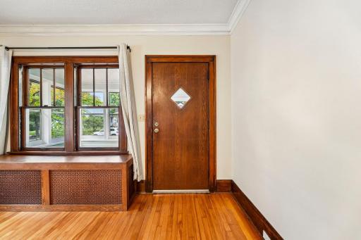 Warm wood entry and beautiful natural wood window trim