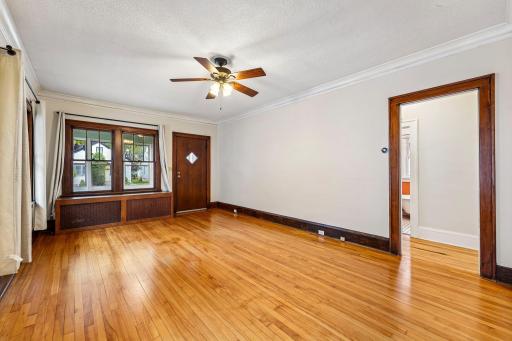 Bright living room with hardwood floors and natural woodwork