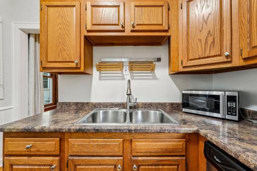 Double-basin sink with convenient counter and cabinet space
