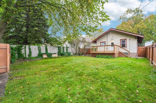 Generous backyard with mature trees and green space