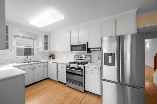 Kitchen with new refrigerator and microwave