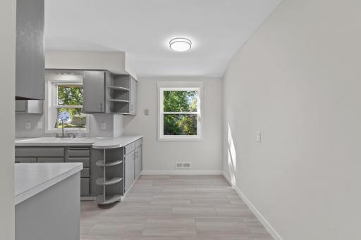 Just off the kitchen, the informal dining area provides a dedicated place for everyday meals without sacrificing kitchen workspace.
