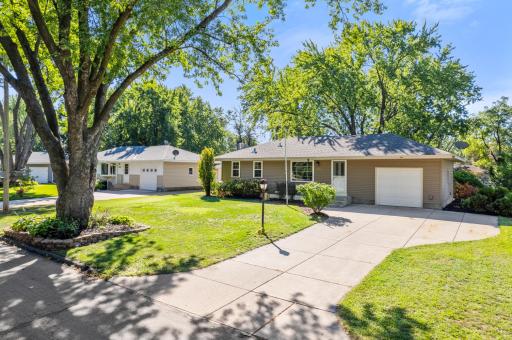 Classic rambler curb appeal with an attached garage, extended concrete driveway and several major exterior improvements already completed.