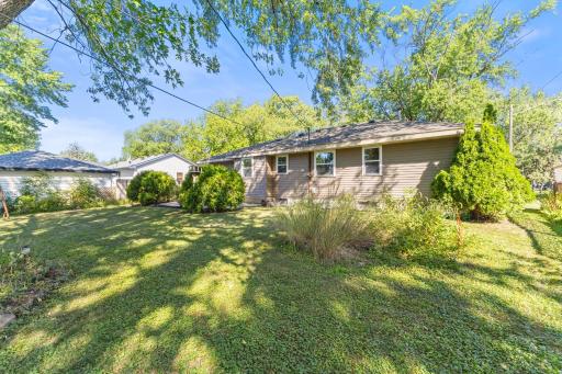 Mature trees and established landscaping give the backyard a private, comfortable feel.