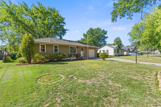 Another look at the home's welcoming exterior, extended driveway and mature landscaping.