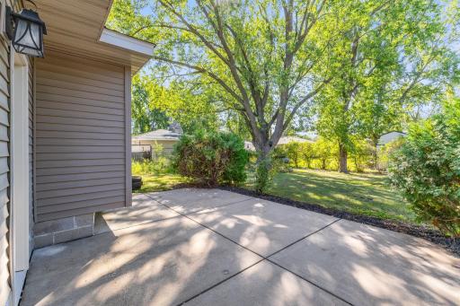 A concrete patio just off the home provides an easy spot for grilling, outdoor dining or relaxing in the backyard.