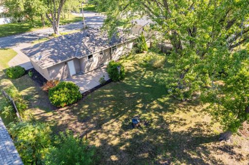 From above, you can appreciate the home's yard, mature tree coverage and established neighborhood setting.