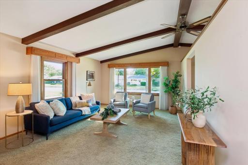 Beamed ceilings span both rooms
