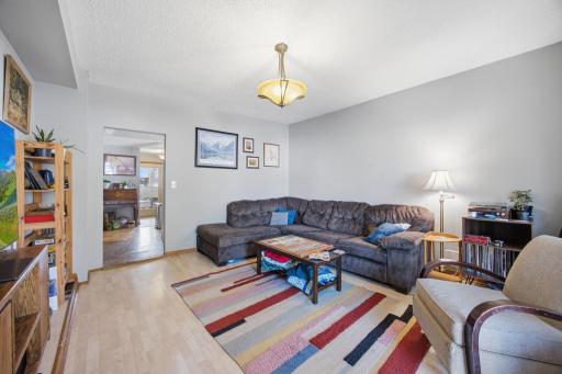 From the entrance, the spacious front living room greets you. Updated and open. Newer front windows.